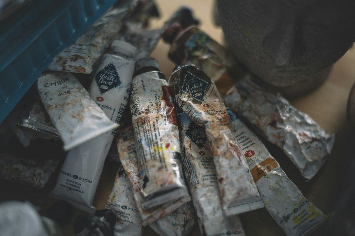 Opening tubes, steadying paper, passing brushes. Photo by Egor Myznik on Unsplash.