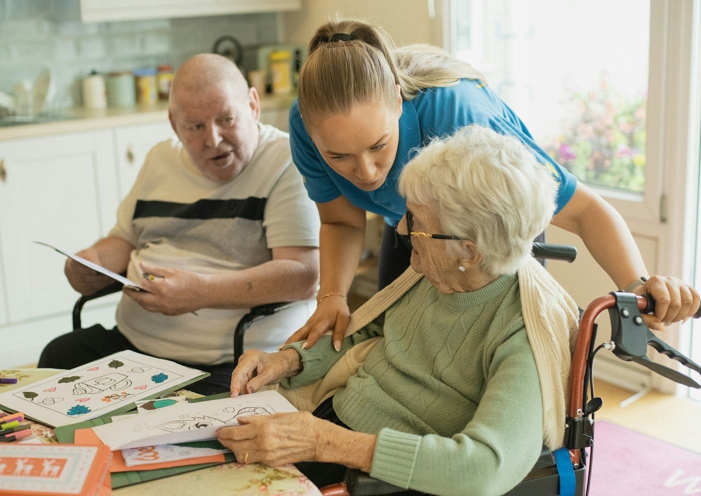 What are the volunteer’s hands doing? Photo by Age Cymru on Unsplash.