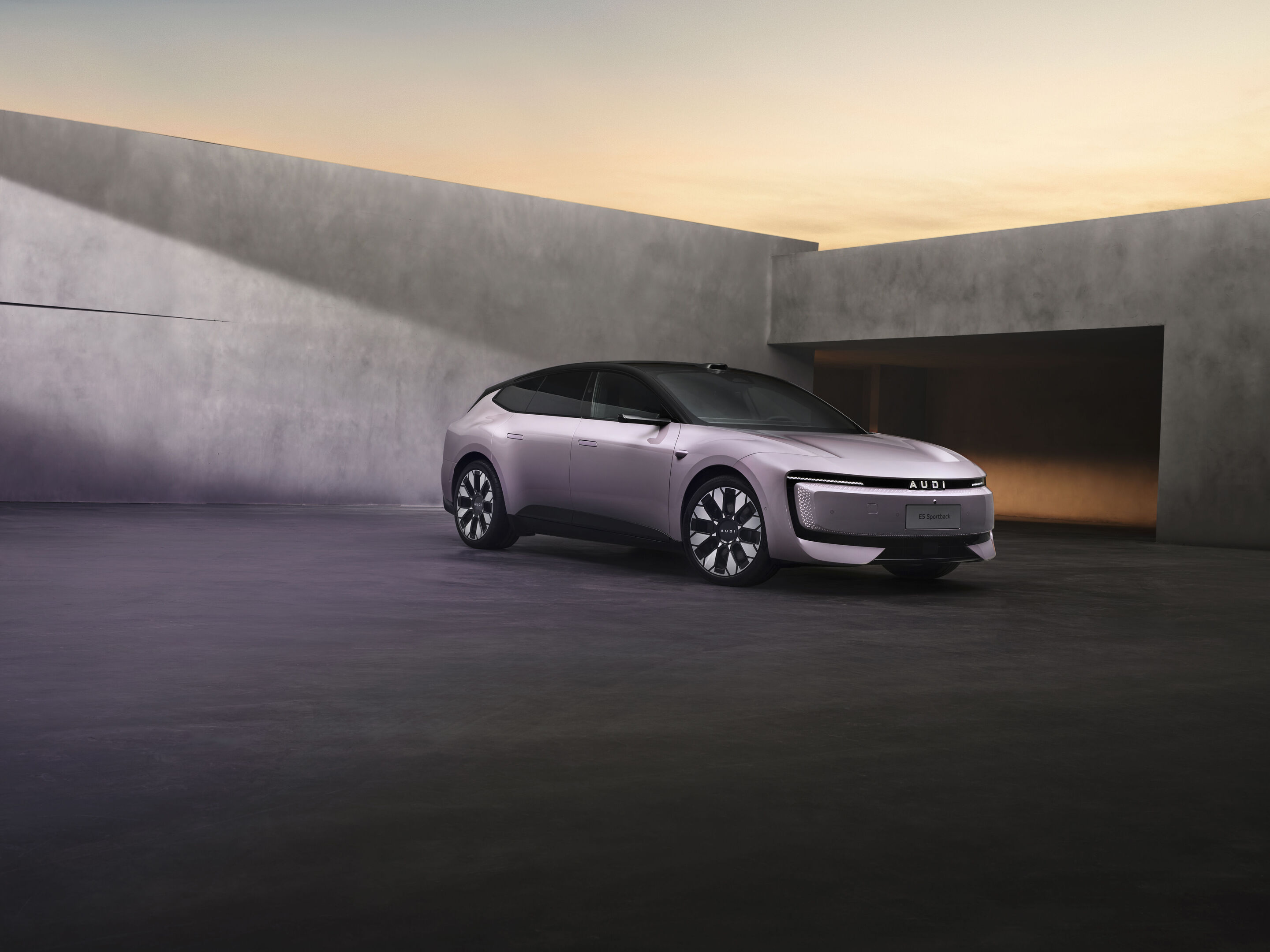 AUDI E5 Sportback in dramatic studio lighting