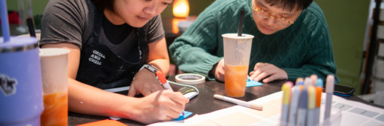 Team members writing during co-design